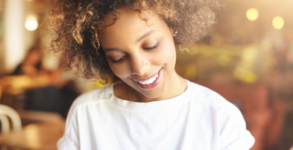 Woman smiling and looking down