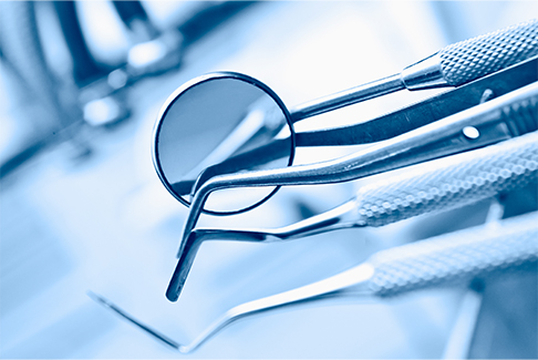 Close up of dental mirrors and other instruments