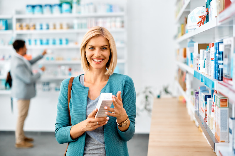 Patient smiling as they grab over-the-counter teeth whitening