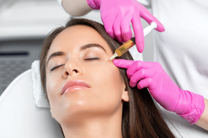 Woman receiving a PRF injection